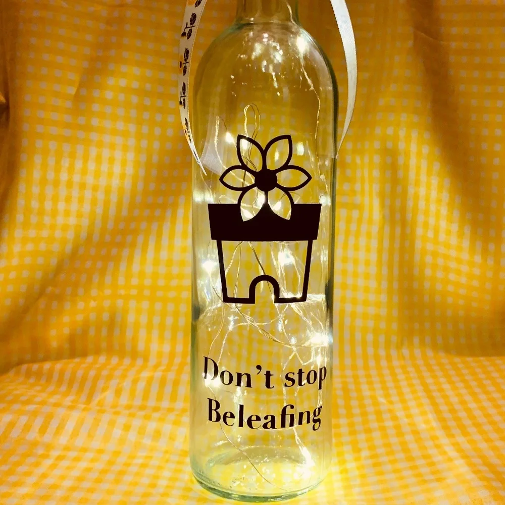 ‘Don’t Stop Beleafing’ logo wine bottle lantern